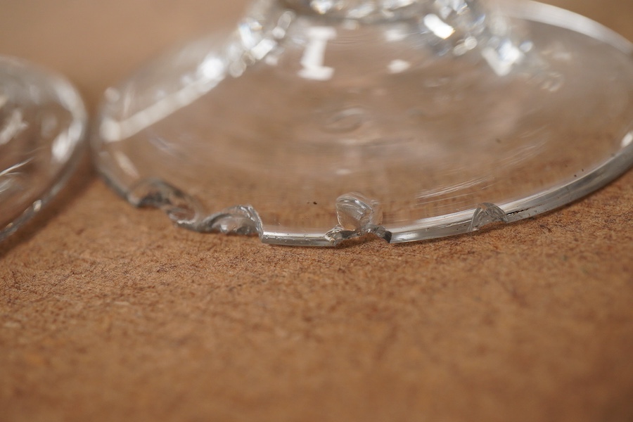 Three 18th century trumpet glasses, two with air twist stems (one with folded foot), together with another with a knopped stem and tear, tallest 16.5cm high